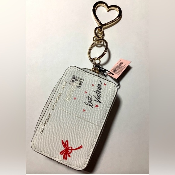 Victoria's Secret 
•8" Postcard Keychain 
•Charm Coin
•Case Greetings From… - Picture 2 of 3